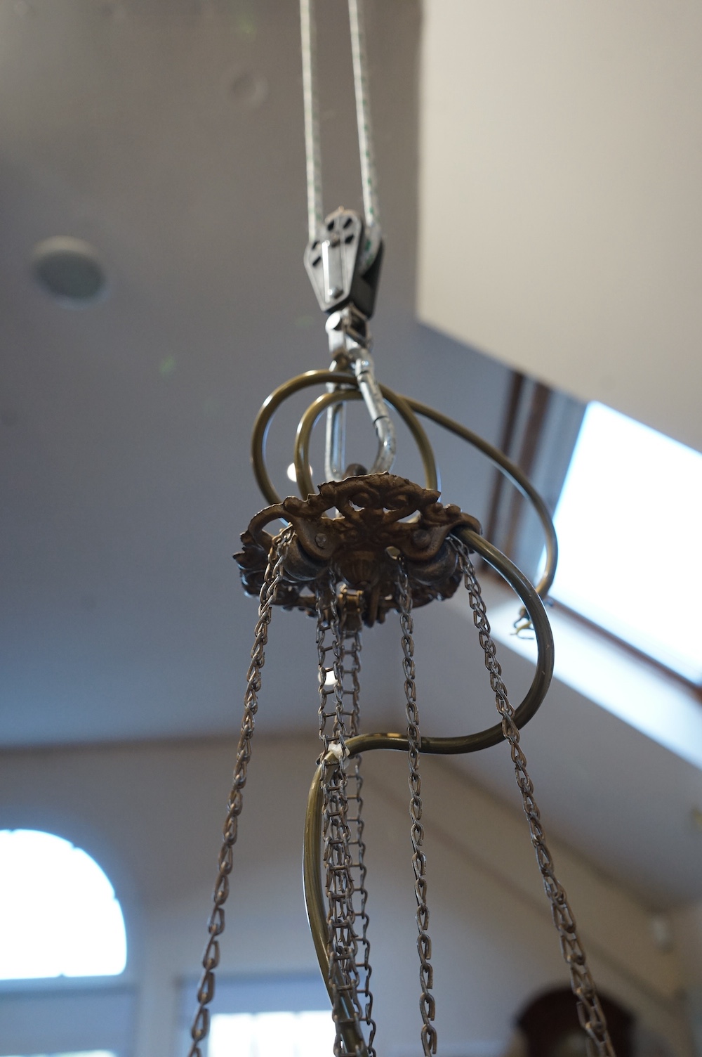 A Moroccan hanging brass and eight panelled glass lantern, 60cm long. Condition - good